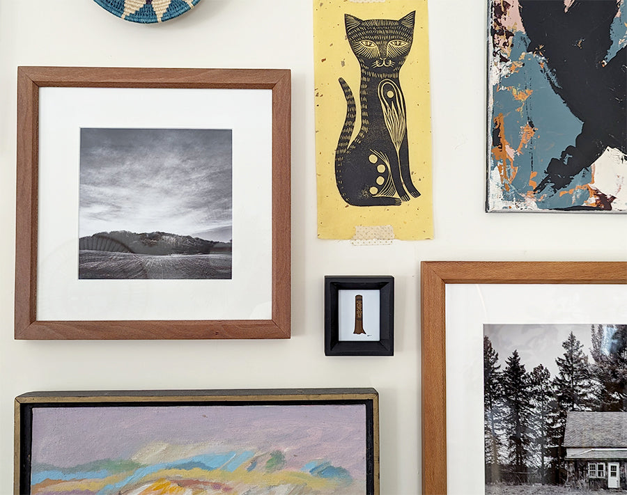 gallery wall filled with meaningful and personal artwork