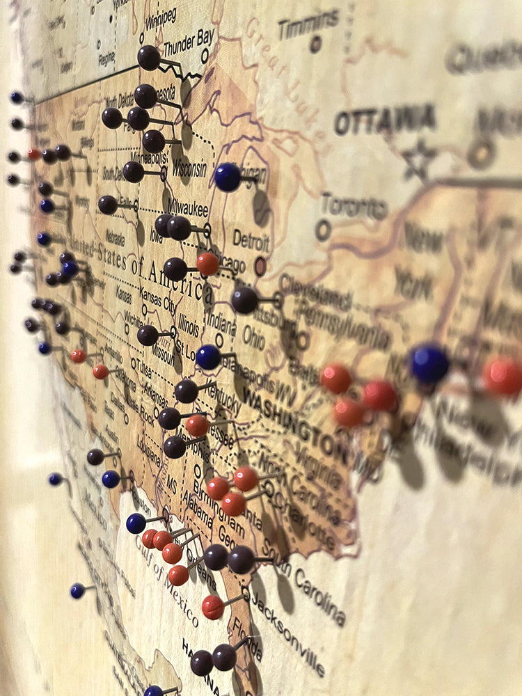 christy johnson's push pin travel map with red, blue, and purple location markers